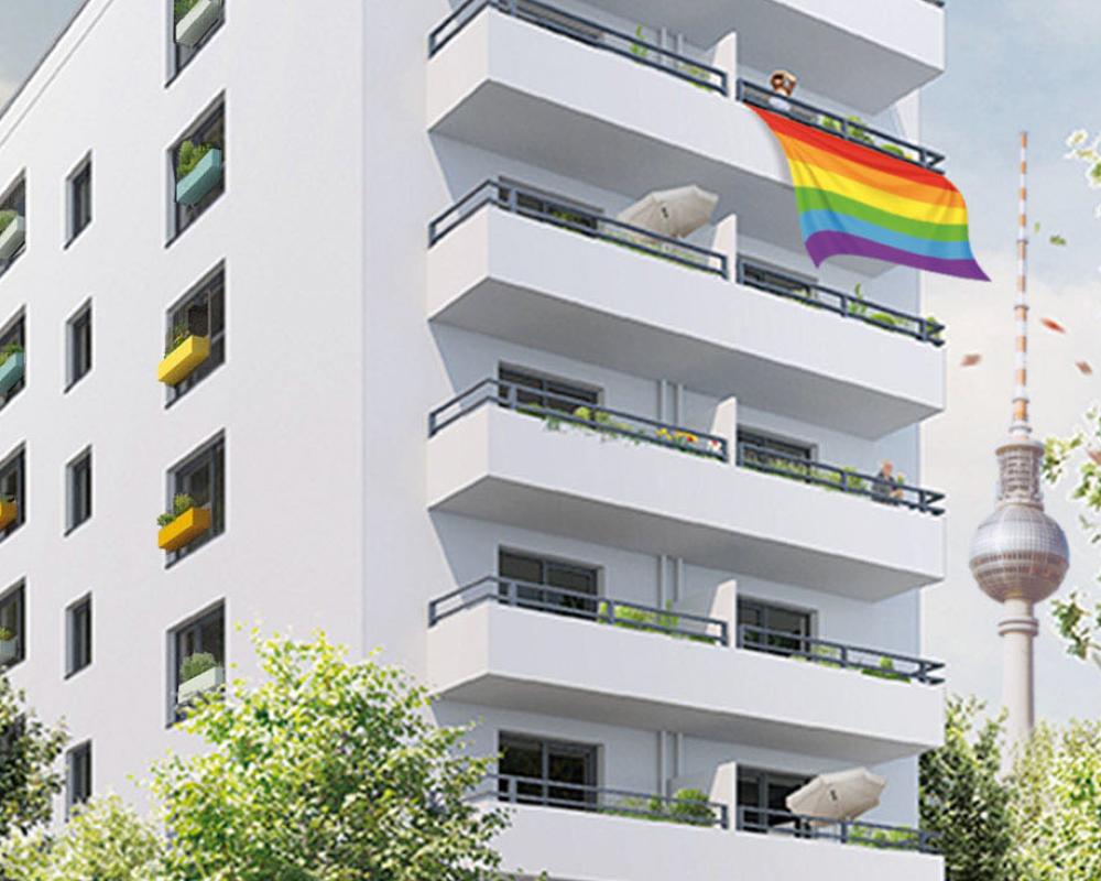 Fiktives 3D-Image des Hauses mit Regenbogenflagge, die von einem der Balkone weht.